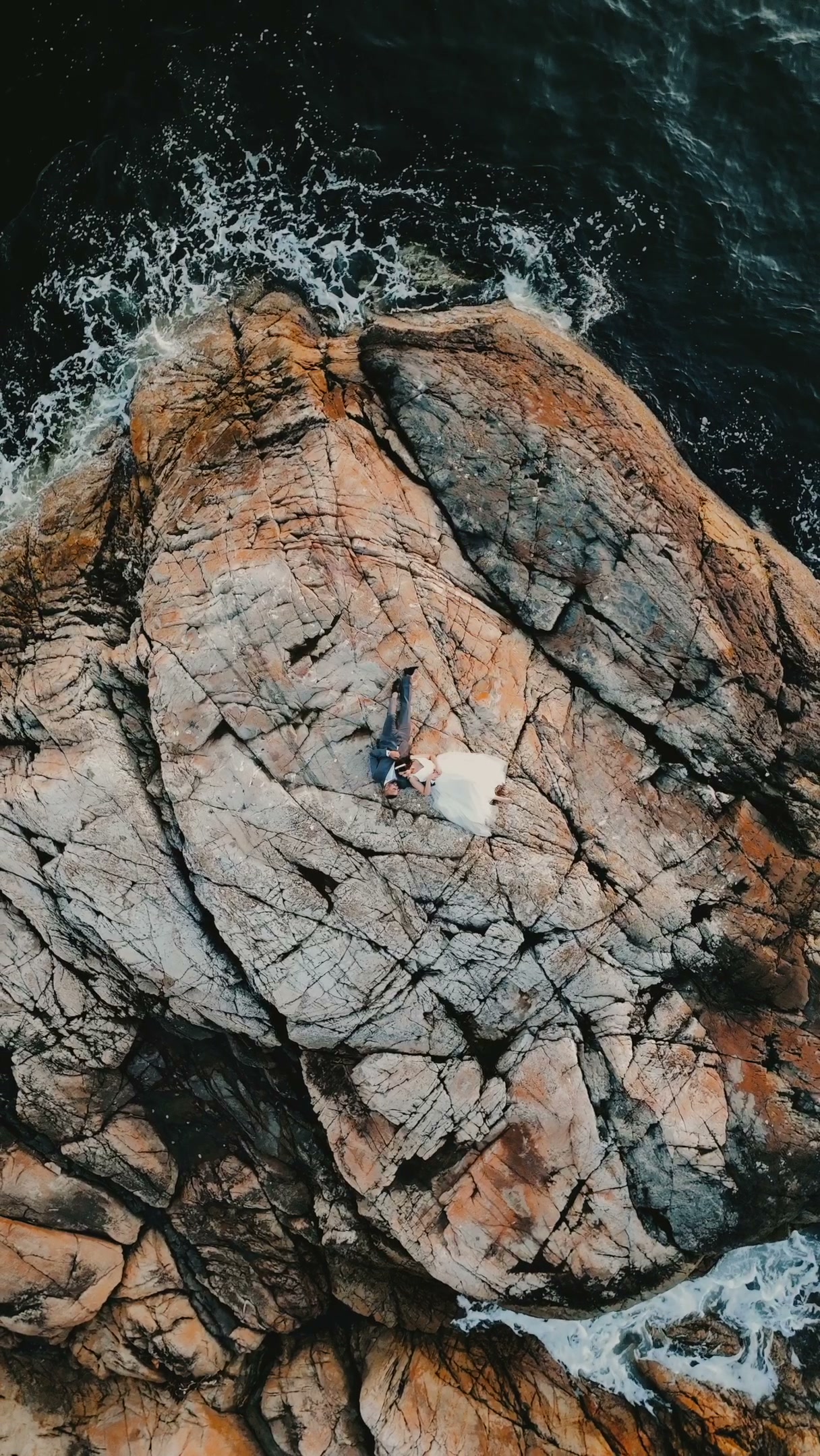 Aerial Drone Wedding Couple on Coastal Rocks, Vancouver, wedding cinematography near Maple Ridge