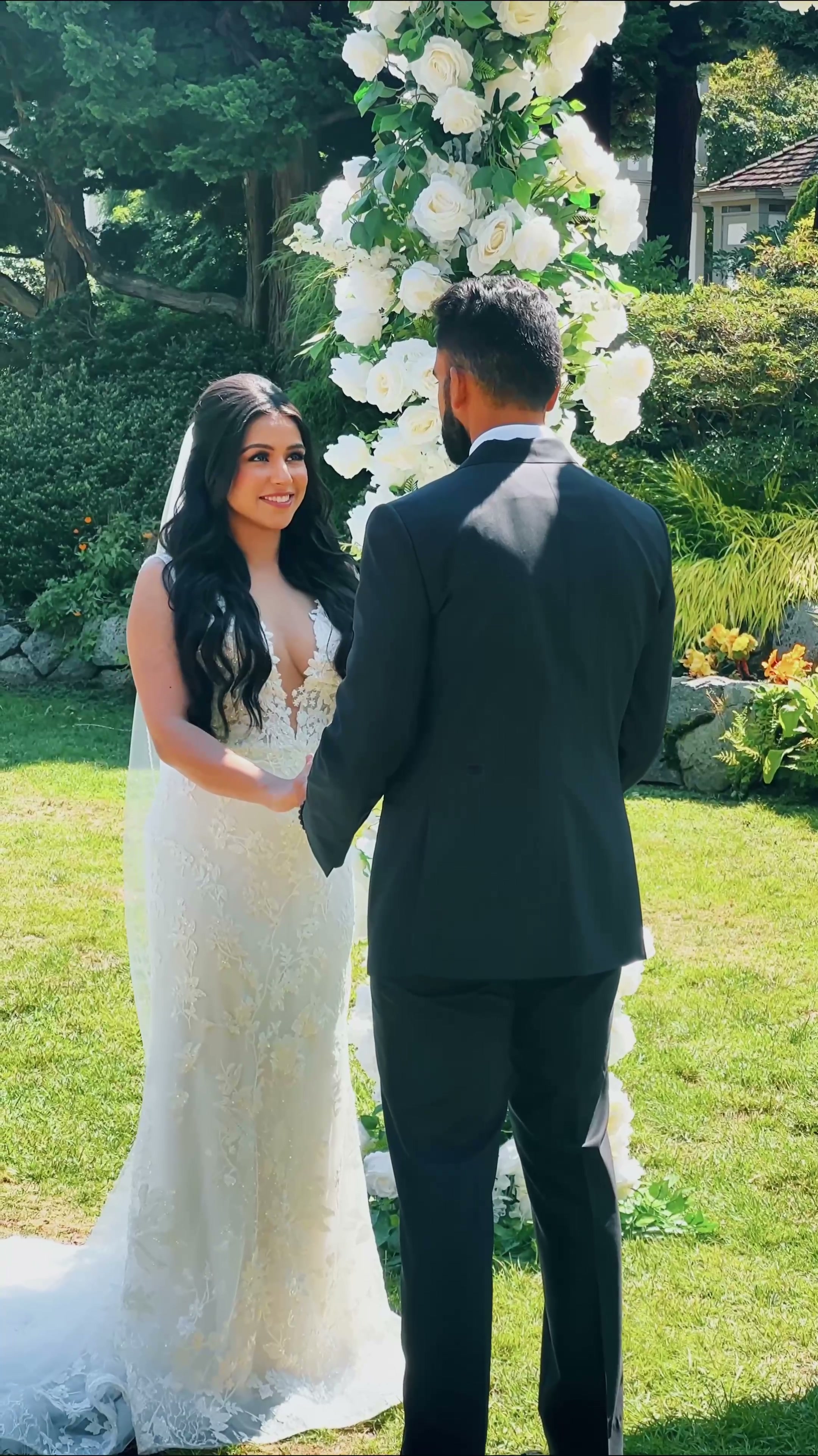 Outdoor Wedding Ceremony under Floral Arch, Vancouver, wedding cinematography near Ladner